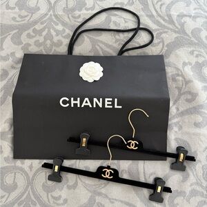 Chanel paper bag with camellia and velvet hangers